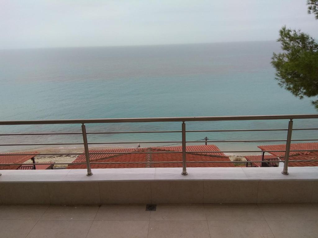 a view of the ocean from a balcony at By the sea with great view luxury in Siviri