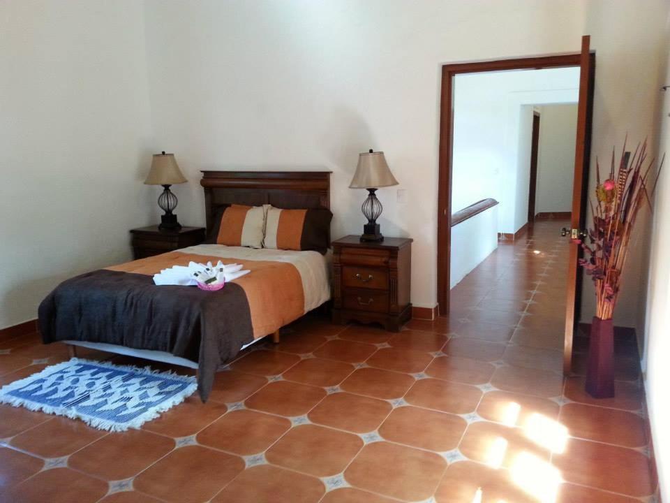 Postel nebo postele na pokoji v ubytování HOTEL ECOTURISTICO LA SALITRERA