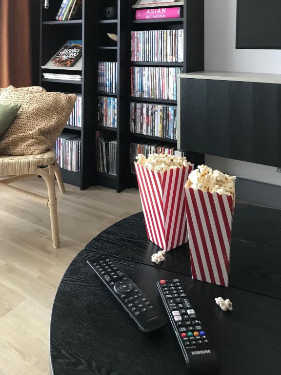 A television and/or entertainment centre at Central Point by Zoom Apartments
