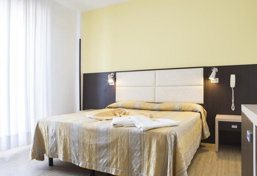 Postel nebo postele na pokoji v ubytování Hotel Alba