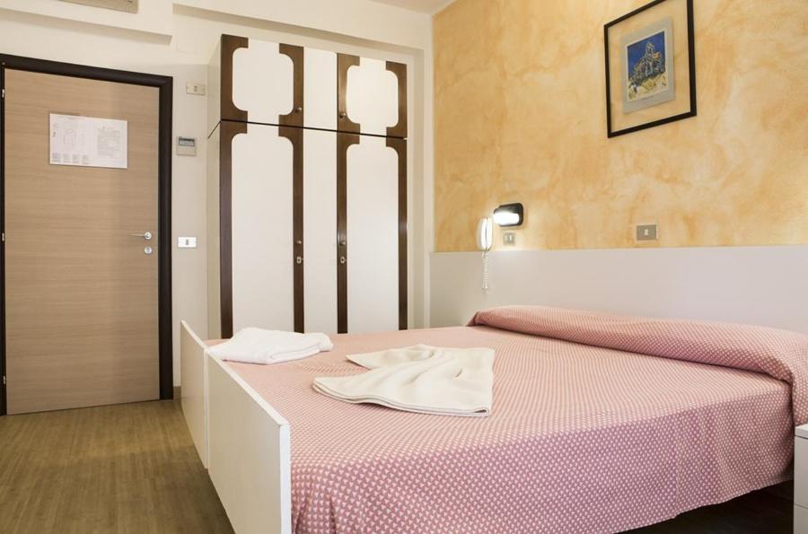 Postel nebo postele na pokoji v ubytování Hotel Alba