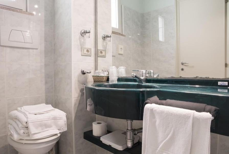 Koupelna v ubytování Hotel Alba
