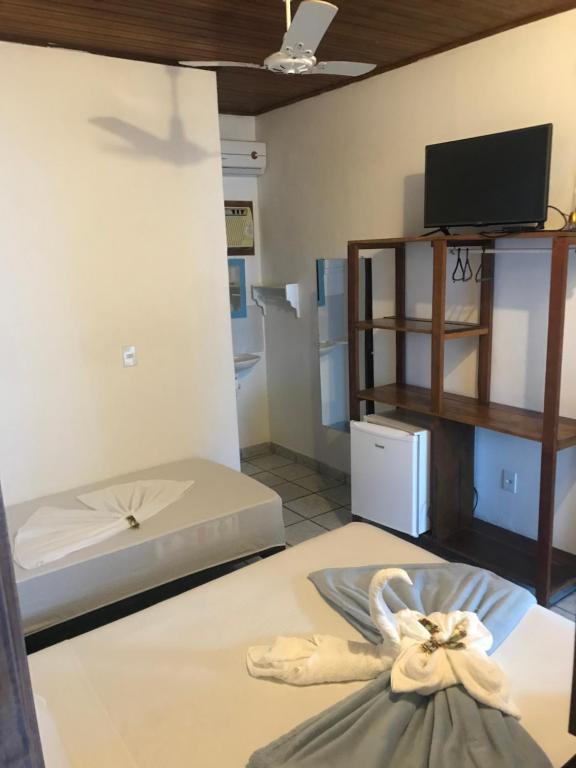 Postel nebo postele na pokoji v ubytování Pousada do Carlos