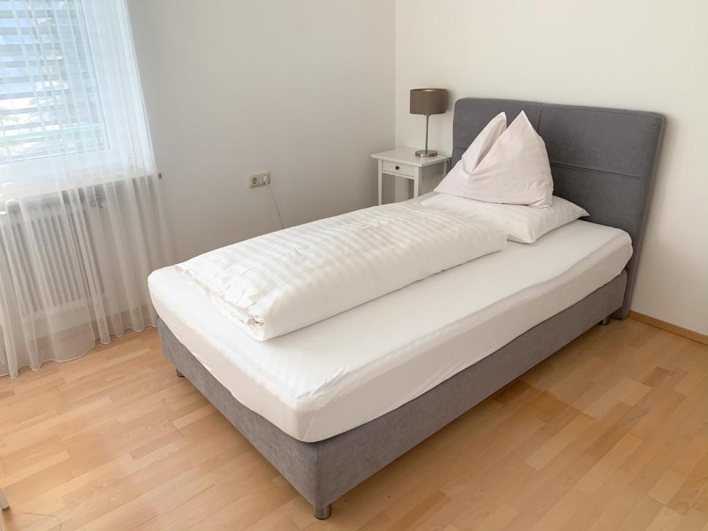 Postel nebo postele na pokoji v ubytování Aparthome L.I.N.Z.
