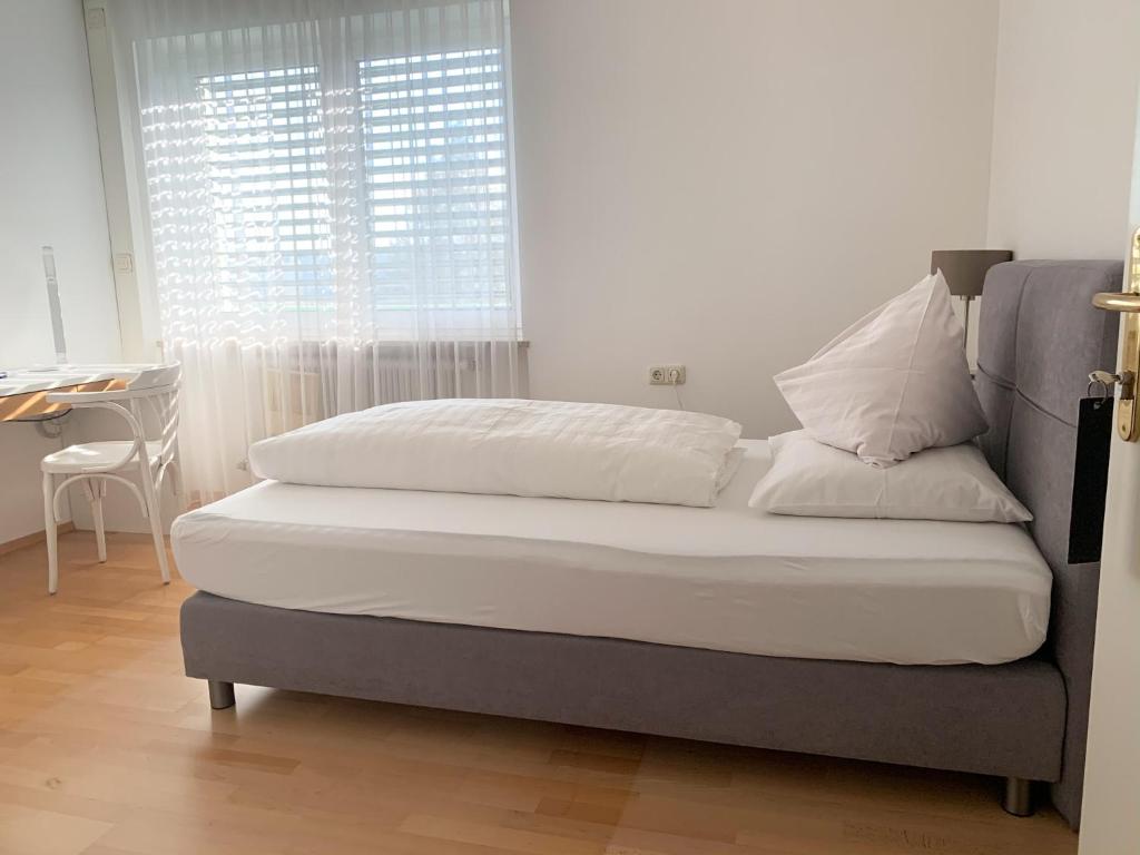 Postel nebo postele na pokoji v ubytování Aparthome L.I.N.Z.