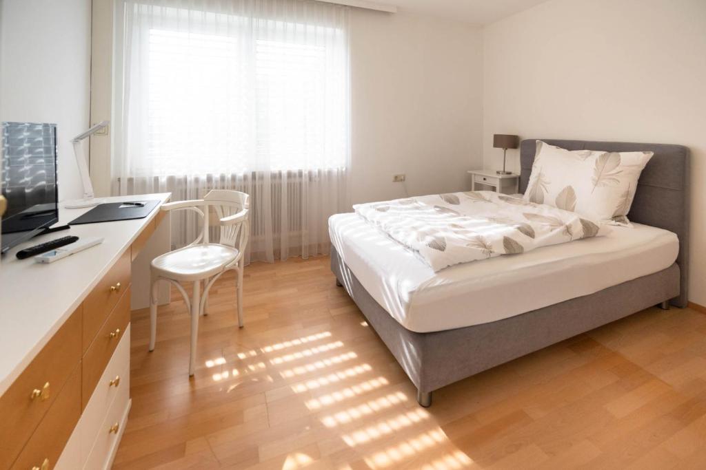 Postel nebo postele na pokoji v ubytování Aparthome L.I.N.Z.