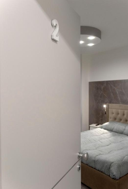 Postel nebo postele na pokoji v ubytování SABRILUNA ROOMS