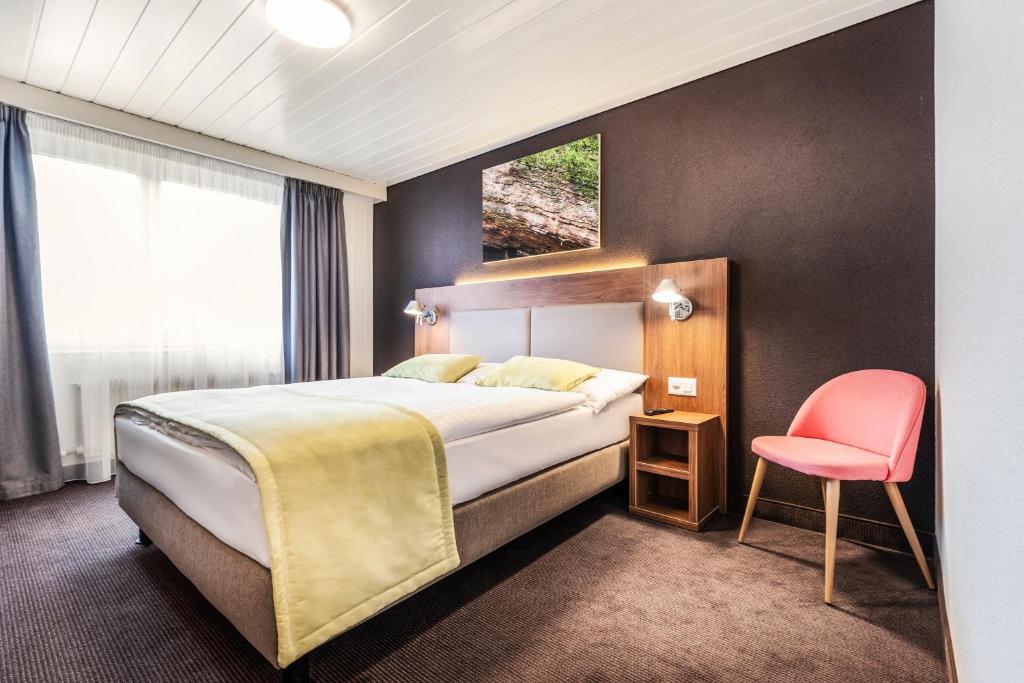 Postel nebo postele na pokoji v ubytování Campanile Martigny