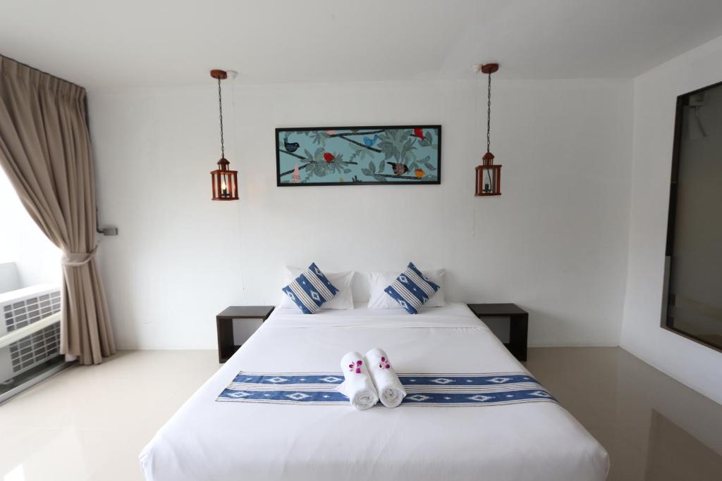 Postel nebo postele na pokoji v ubytování The Nest Resort Patong