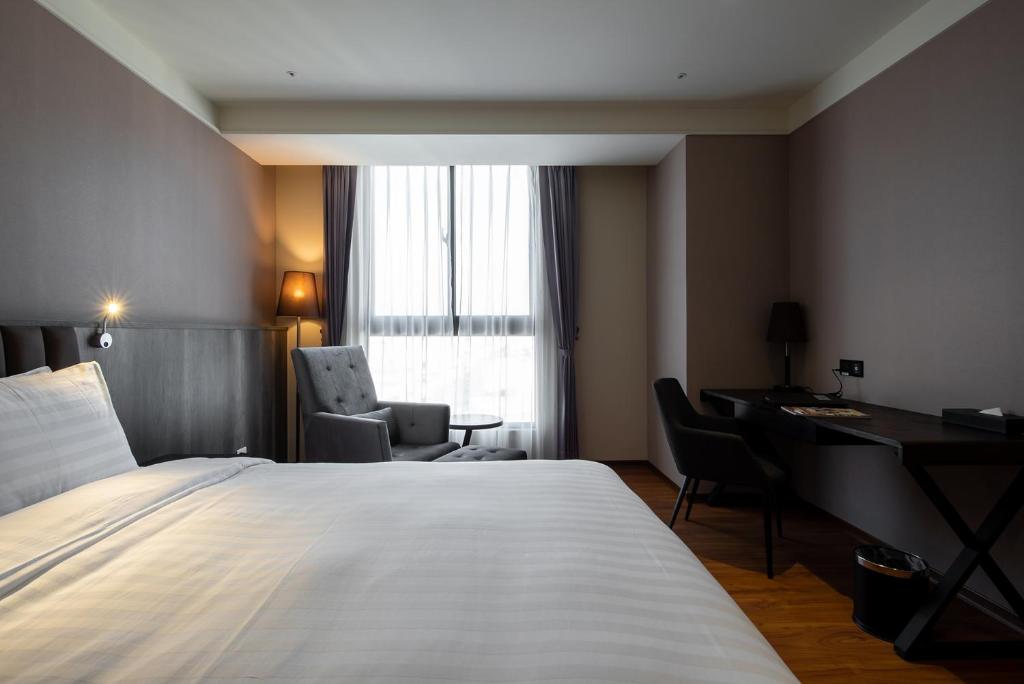 Postel nebo postele na pokoji v ubytování Lai Hotel