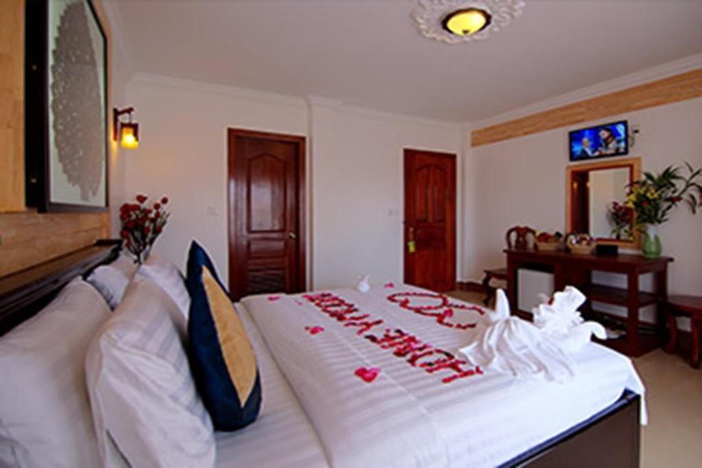 Postel nebo postele na pokoji v ubytování Bou Phanith Villa