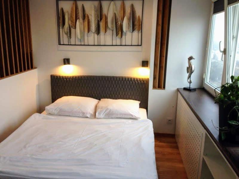 Posteľ alebo postele v izbe v ubytovaní Alma Apartments Smolna