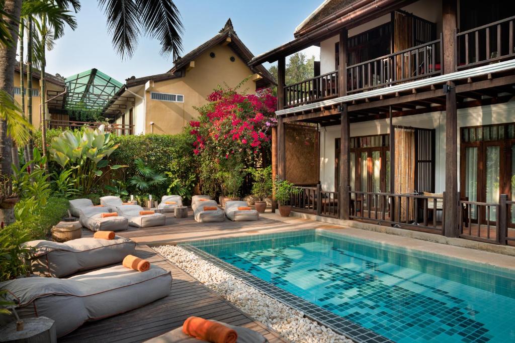 a swimming pool in the backyard of a house at Maison Dalabua in Luang Prabang