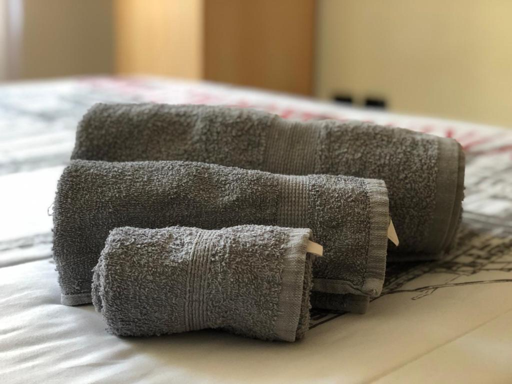 Łóżko lub łóżka w pokoju w obiekcie Viale Umberto I Apartments