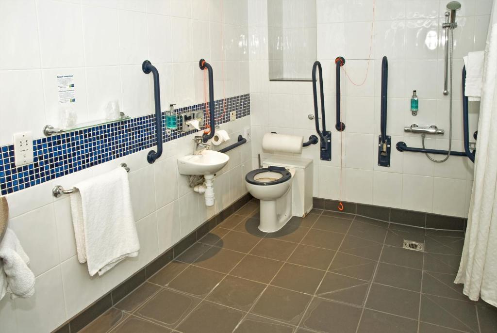 a bathroom with a toilet and a sink at Holiday Inn Express Ramsgate – Minster by IHG in Minster