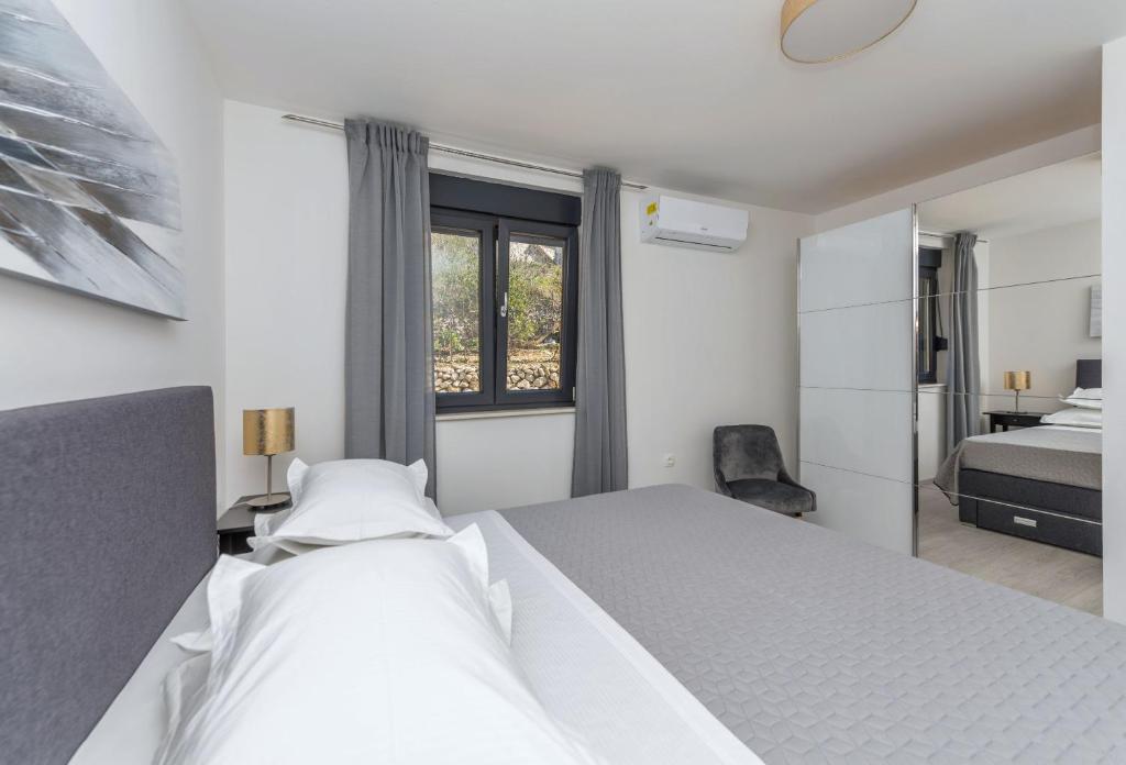 Postel nebo postele na pokoji v ubytování Sun Paradise