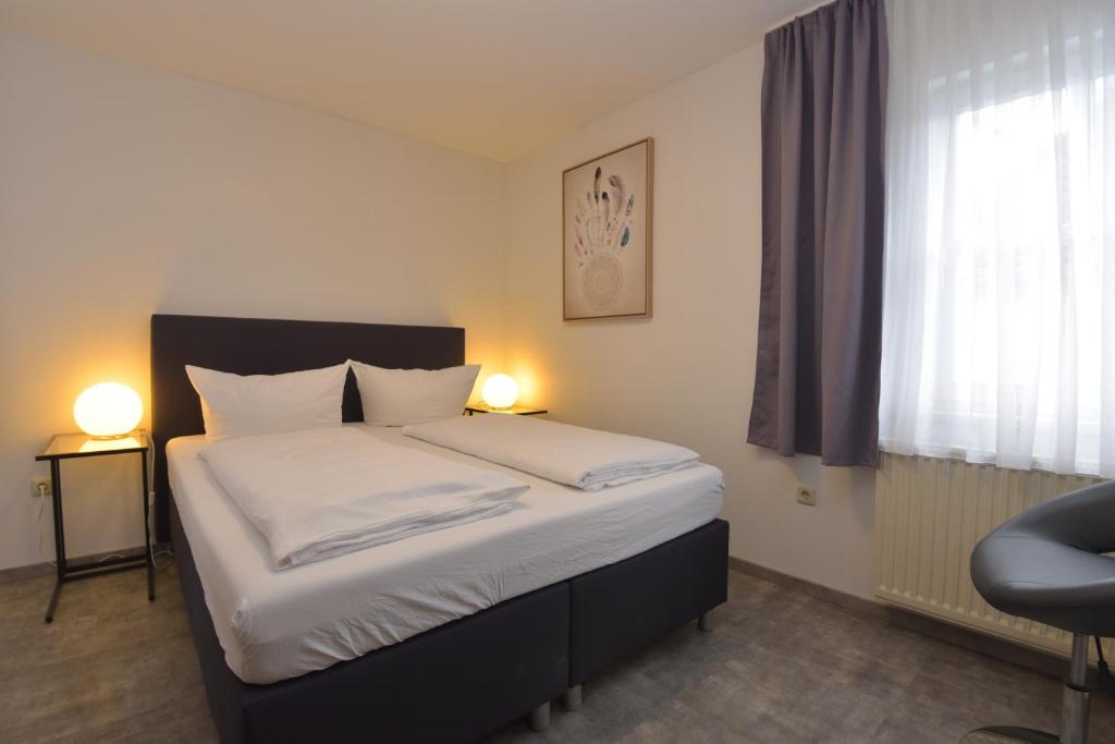 Postel nebo postele na pokoji v ubytování Hotel Wolke