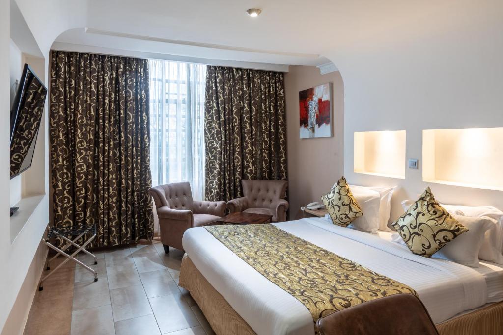 Postel nebo postele na pokoji v ubytování Hotel Waterbuck