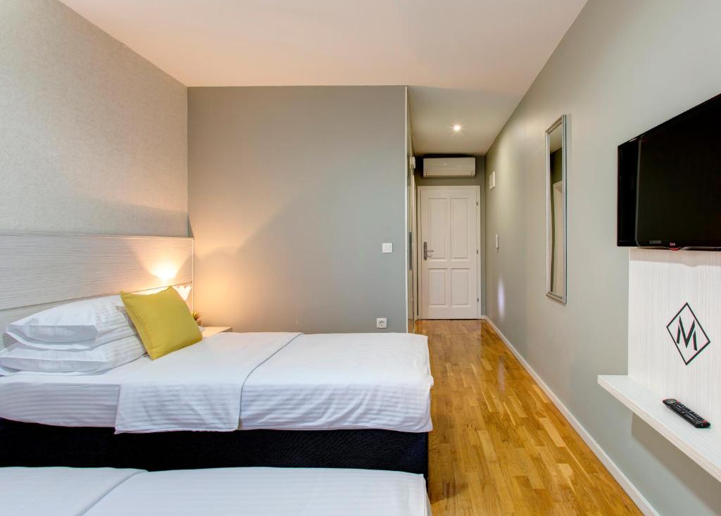 Postel nebo postele na pokoji v ubytování Hotel Villa Milas