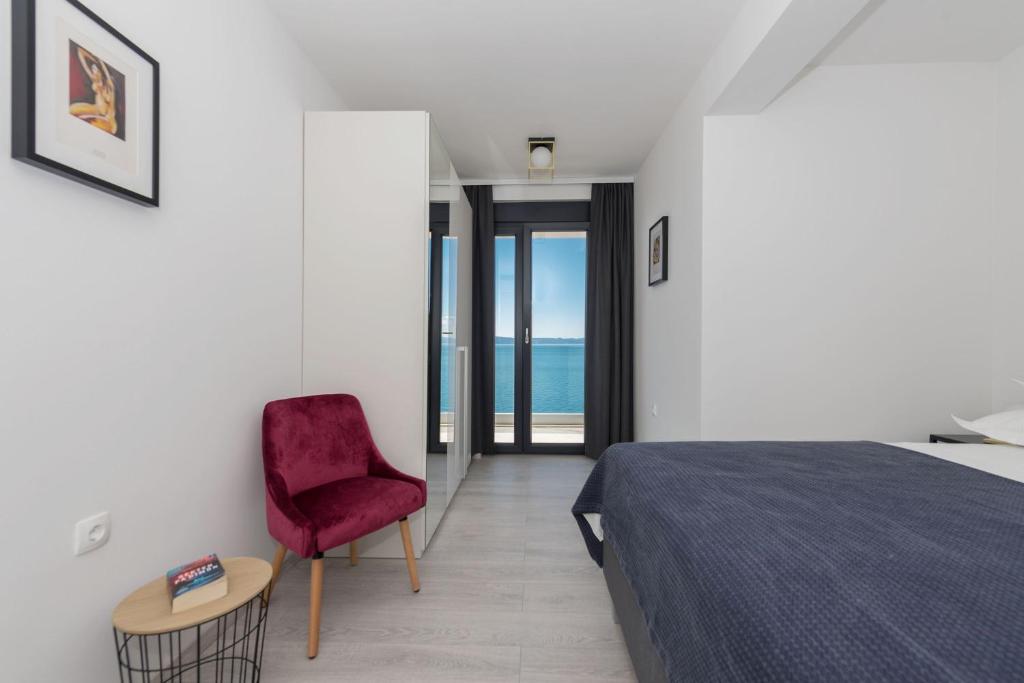 Postel nebo postele na pokoji v ubytování Sun Paradise