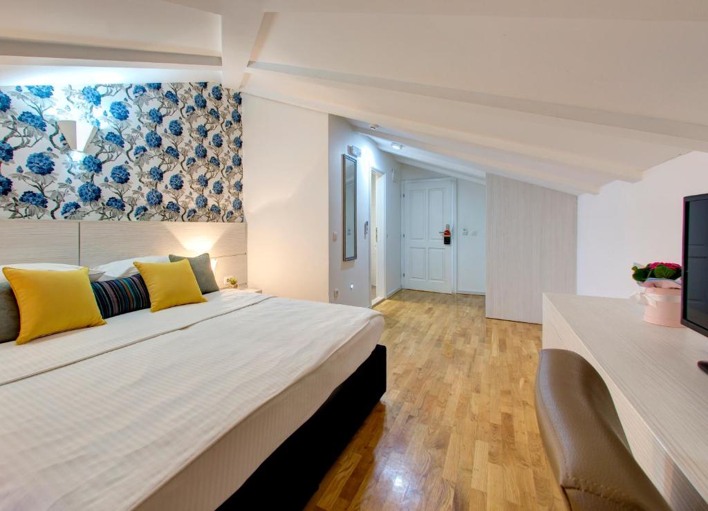 Postel nebo postele na pokoji v ubytování Hotel Villa Milas