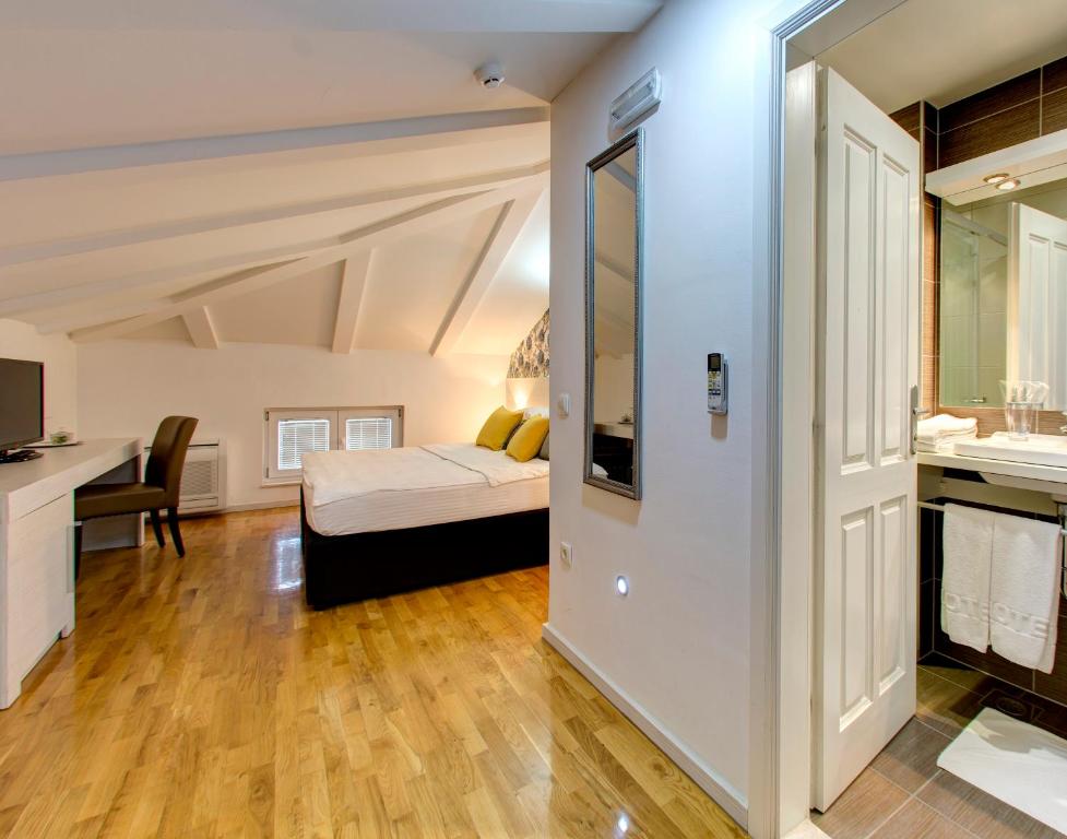 Postel nebo postele na pokoji v ubytování Hotel Villa Milas