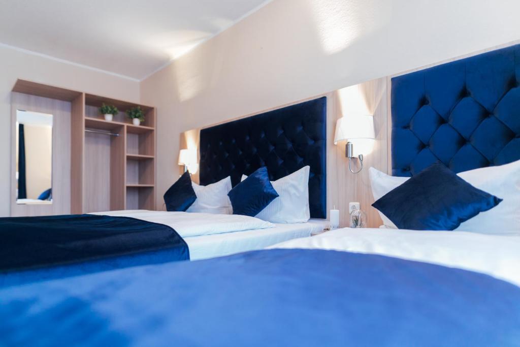 Postel nebo postele na pokoji v ubytování Hotel CULT Hamburg