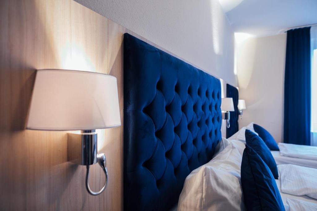 Postel nebo postele na pokoji v ubytování Hotel CULT Hamburg