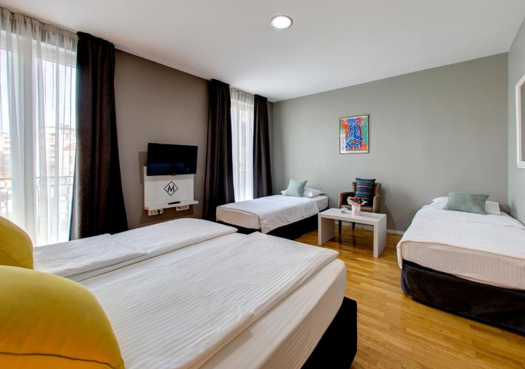 Postel nebo postele na pokoji v ubytování Hotel Villa Milas
