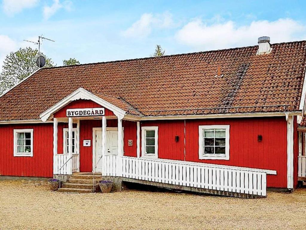 a red building with a red roof at 5 person holiday home in LAMMHULT SVERIGE in Förhult