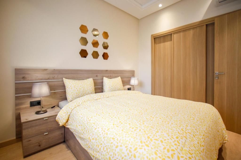 Letto o letti in una camera di Flamant Rose Appart Hotel