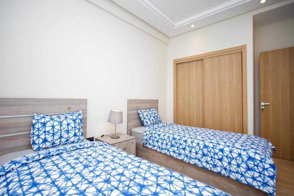 Letto o letti in una camera di Flamant Rose Appart Hotel
