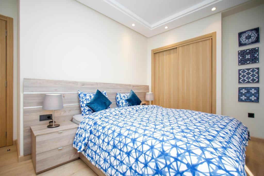 Letto o letti in una camera di Flamant Rose Appart Hotel