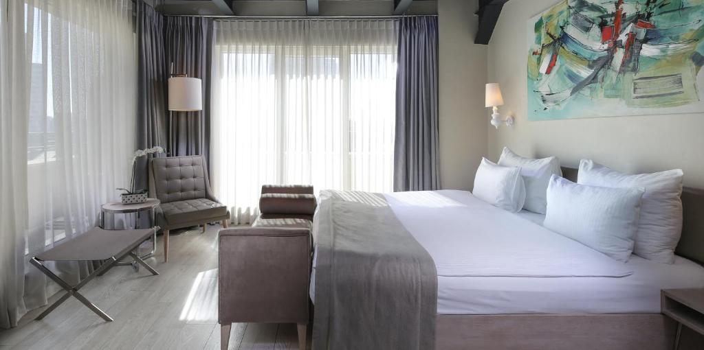 A bed or beds in a room at The Gate Ataşehir Finance Centre
