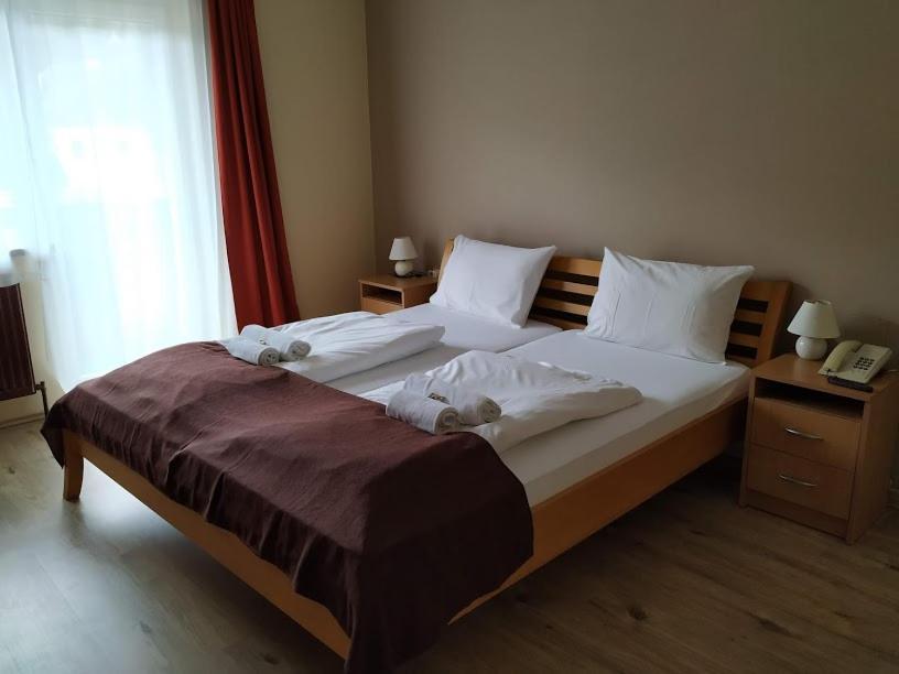 Postel nebo postele na pokoji v ubytování Pension Tilly
