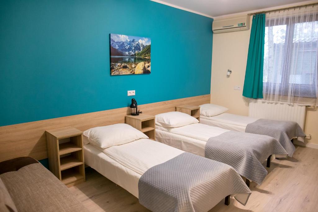 Posteľ alebo postele v izbe v ubytovaní Eko Hotel Na Wierzynka & Park Pinokia
