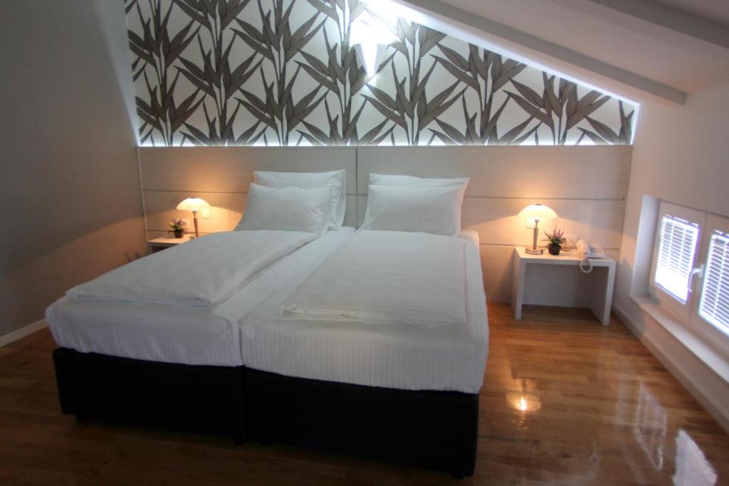 Postel nebo postele na pokoji v ubytování Hotel Villa Milas