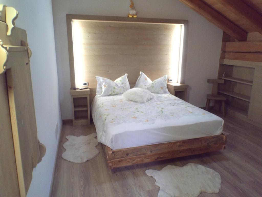 Postel nebo postele na pokoji v ubytování B&B antico tabià dolomitico