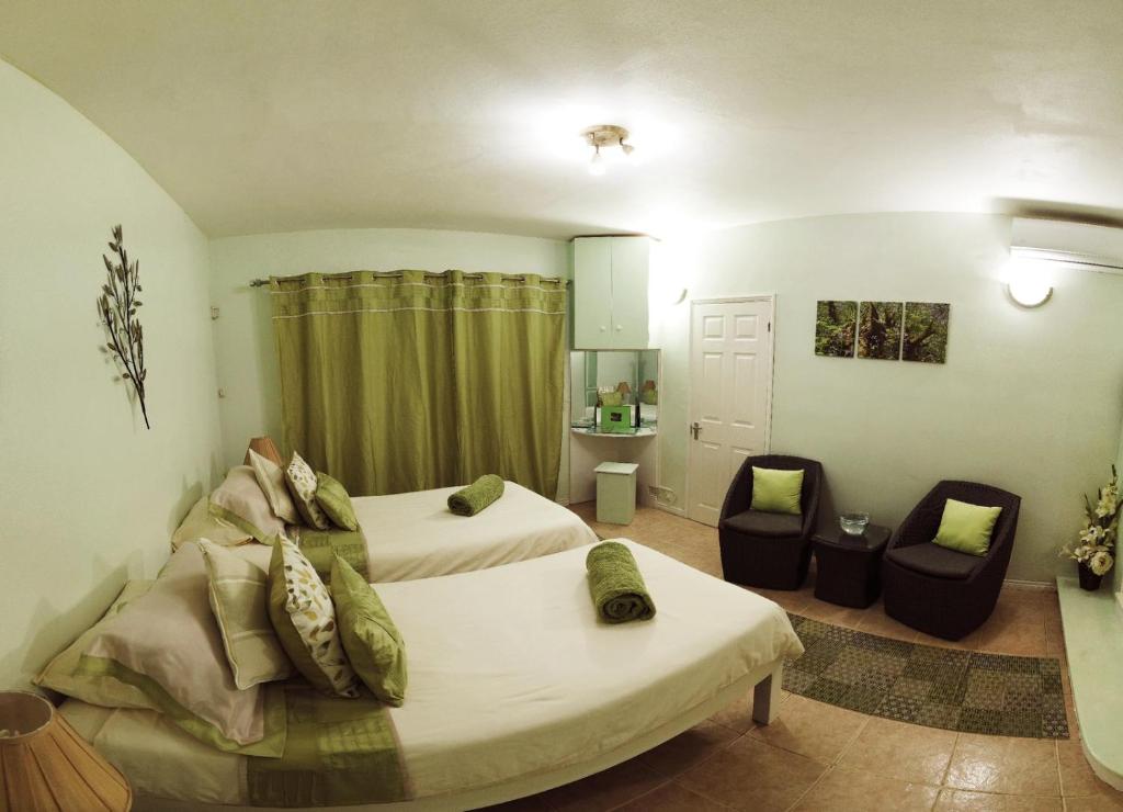 Postel nebo postele na pokoji v ubytování Marisa Residences