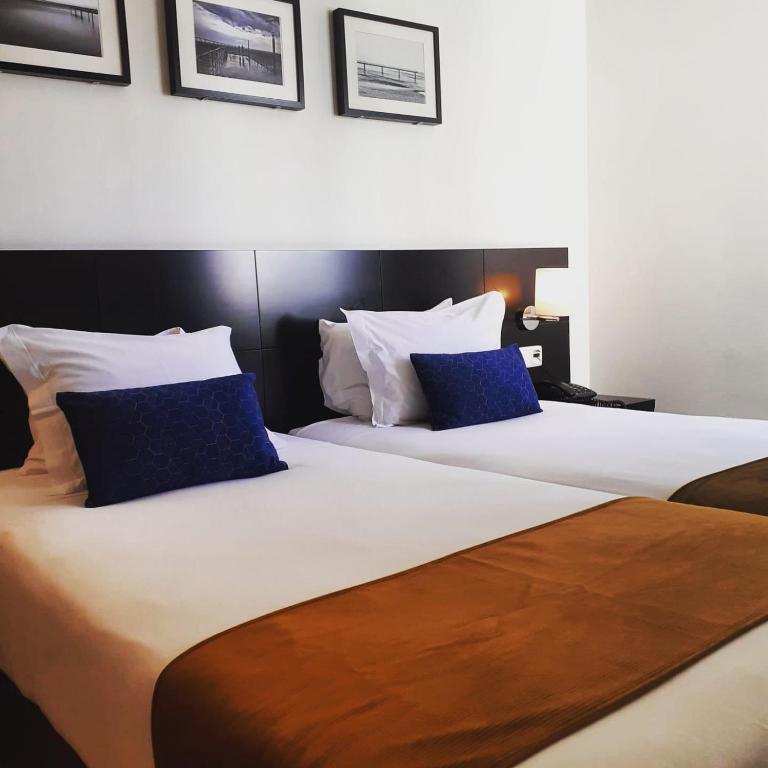 A bed or beds in a room at Lisbon City Hotel by City Hotels