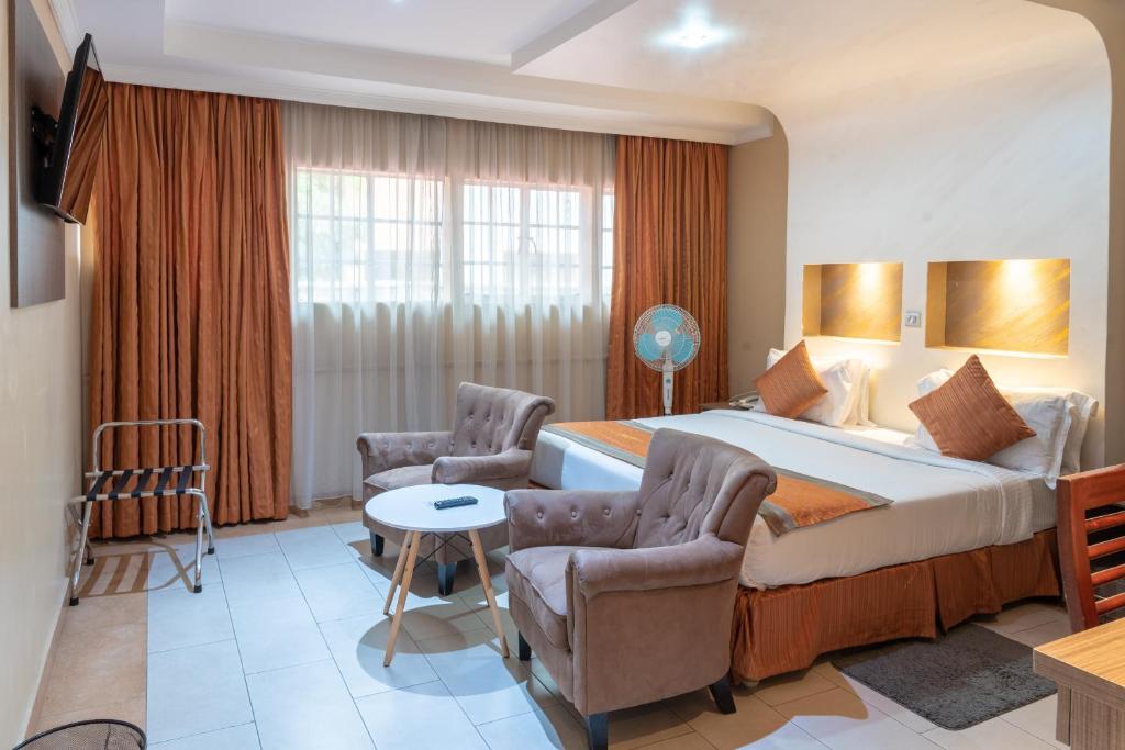 Postel nebo postele na pokoji v ubytování Hotel Waterbuck