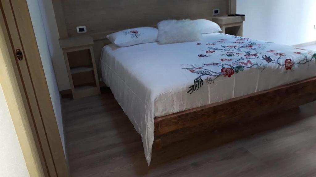 Postel nebo postele na pokoji v ubytování B&B antico tabià dolomitico