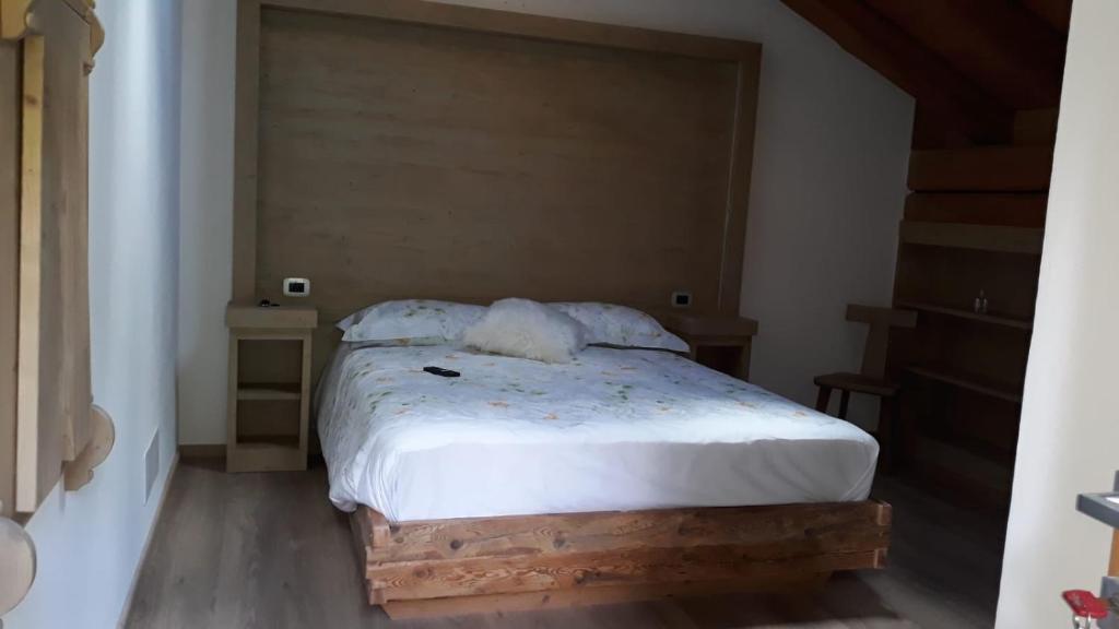 Postel nebo postele na pokoji v ubytování B&B antico tabià dolomitico