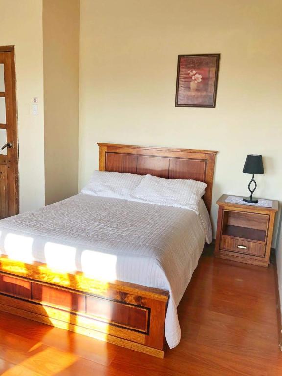 Postel nebo postele na pokoji v ubytování Hosteria San Carlos Tababela