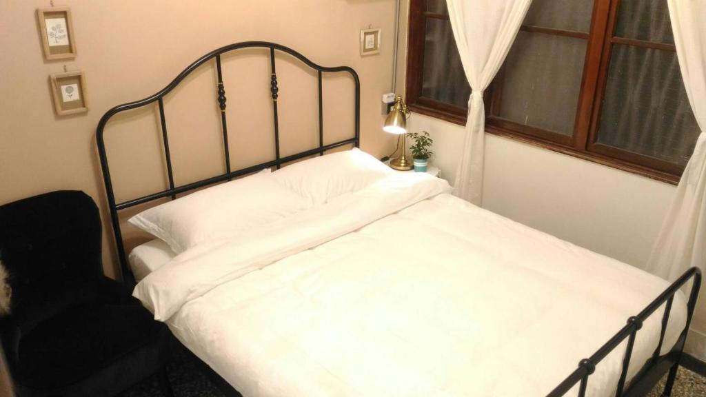 Postel nebo postele na pokoji v ubytování i老宅