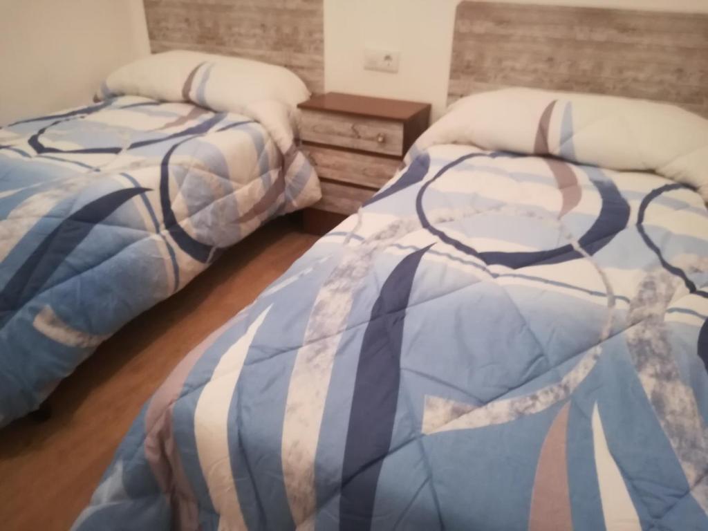 Ένα ή περισσότερα κρεβάτια σε δωμάτιο στο san leon