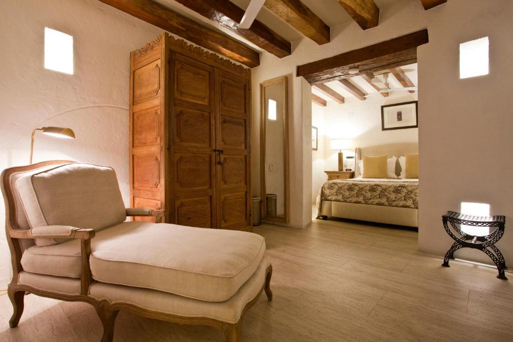 Postel nebo postele na pokoji v ubytování Hotel Boutique Casa del Coliseo