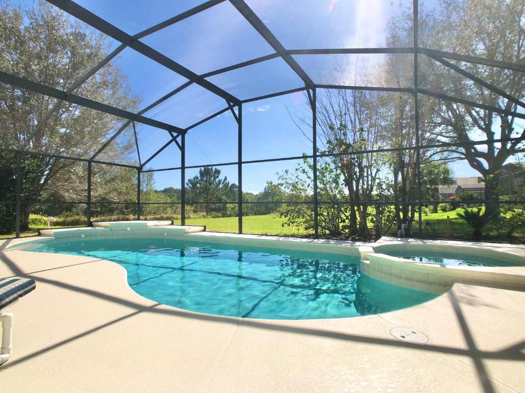 a large swimming pool with a glass roof at The Oasis in Orlando