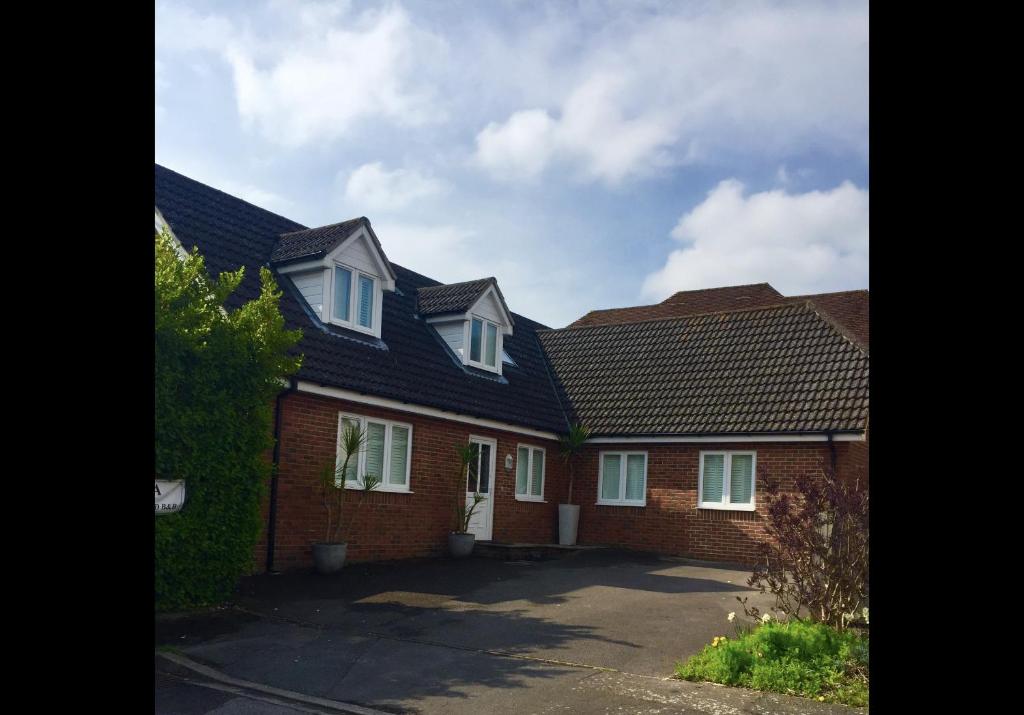 a row of brick houses with roofs at Harford en-suite Rooms in Lymington