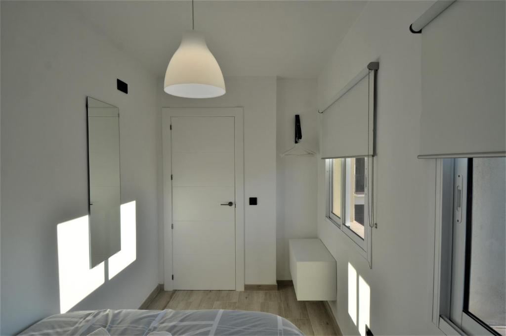 A bed or beds in a room at ATICO DE LUJO EN EL CENTRO HISTÓRICO